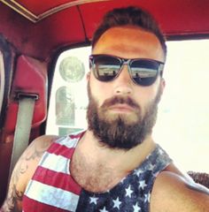 Bearded man wearing American flag tank top