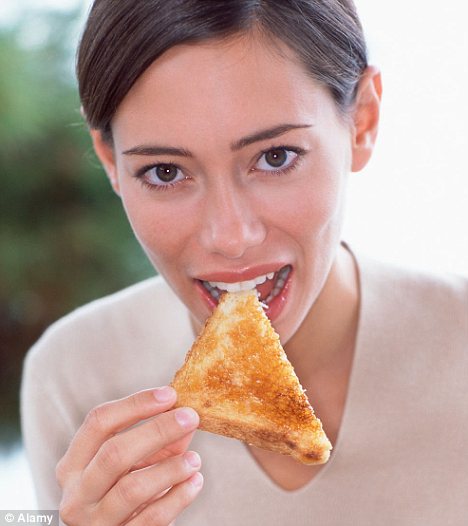 A woman eating toast