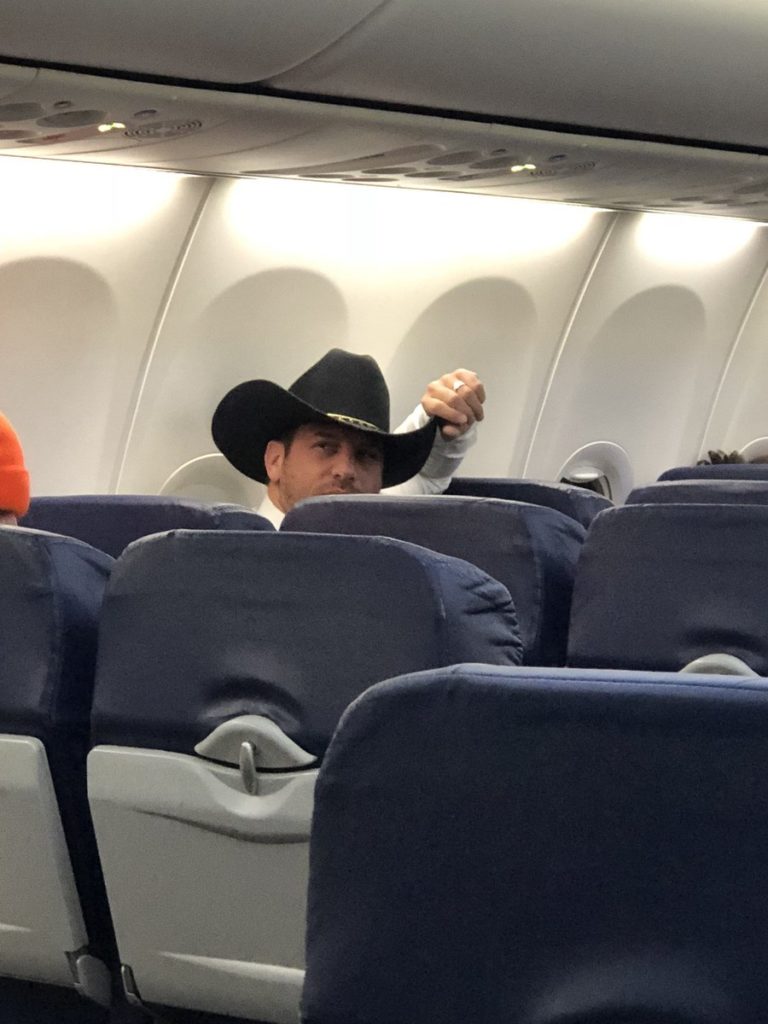 Drew Gulak in a large cowboy hat