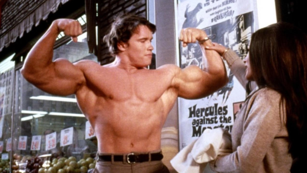 Arnold Schwarzenegger flexes his muscles as the titular lead in Hercules in New York