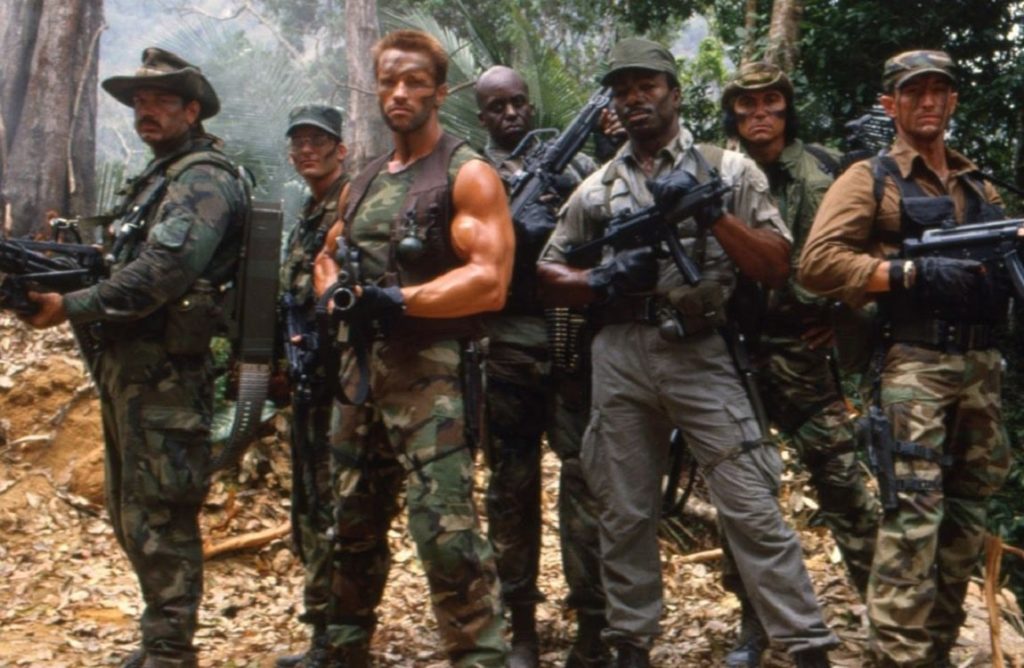 Arnold Schwarzaneggar stands with the other hired mercanaries in a promo shot for the movie, Predator