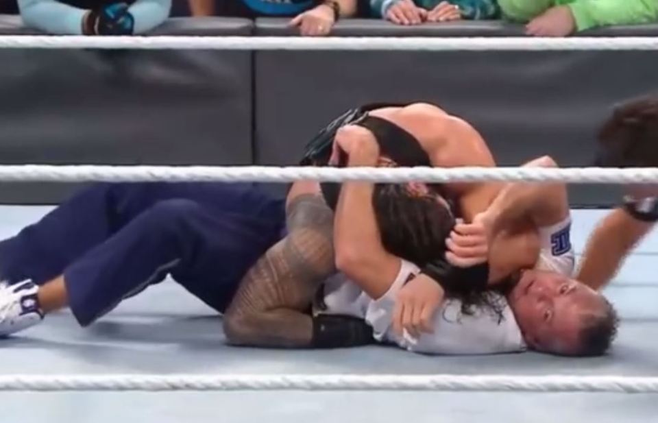 Shane McMahon appears to be injured after a Roman Reigns spear at Survivor Series 2016