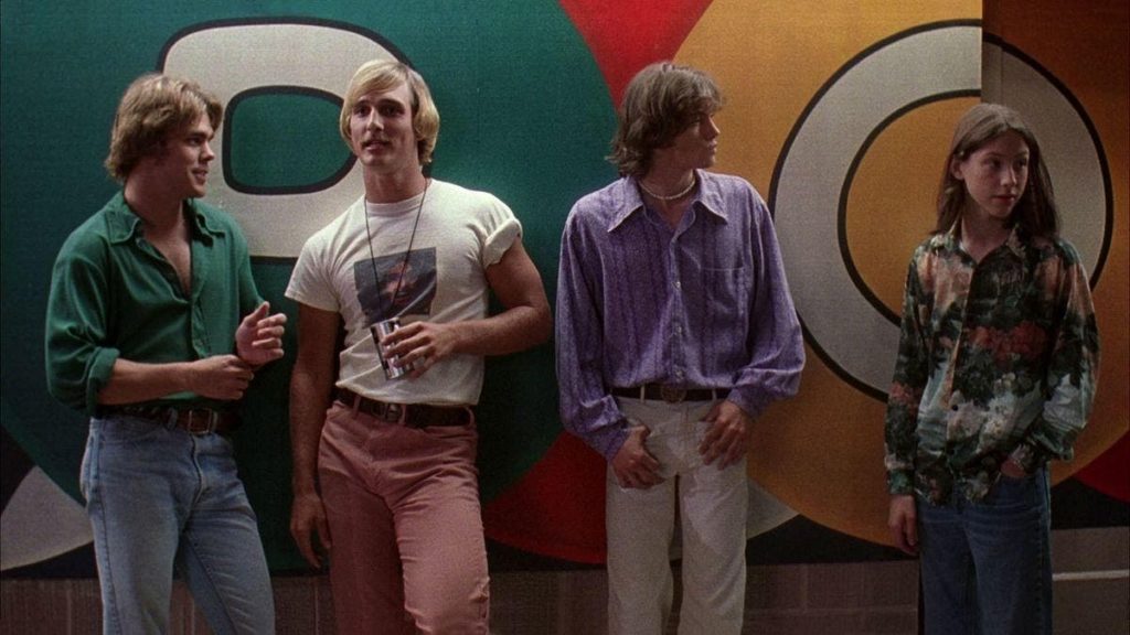 The cast of Dazed and Confused stands together in a hallway